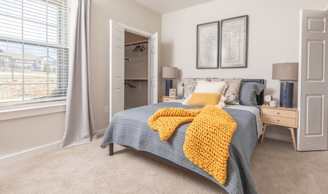bedroom with bed and large window